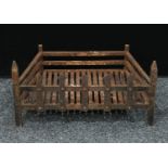 A cast iron country house fire basket