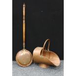 A copper coal scuttle, brass swing handle; a copper warming pan (2)