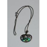 Charles Horner - an Art Nouveau enameled silver pendant necklace, open cast shaped oval leafy