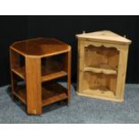 A revolving bookcase/coffee table; a small open shelved pine corner cupboard (2)
