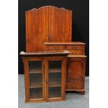 An art deco walnut wardrobe, the interior fitted with shelves and drawers, 199cm high, 53cm deep,