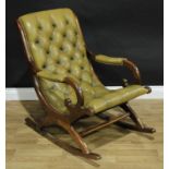 A regency style Chesterfield type rocking open arm chair. 88cm high.