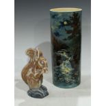 A Langley Ware squirrel, eating a nut, 20cm high, pritned mark; a Royal Doulton cylindrical vase,