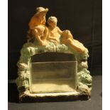 An early 20th century painted chalk ware/plaster model, comprising of two boys above a glass fish