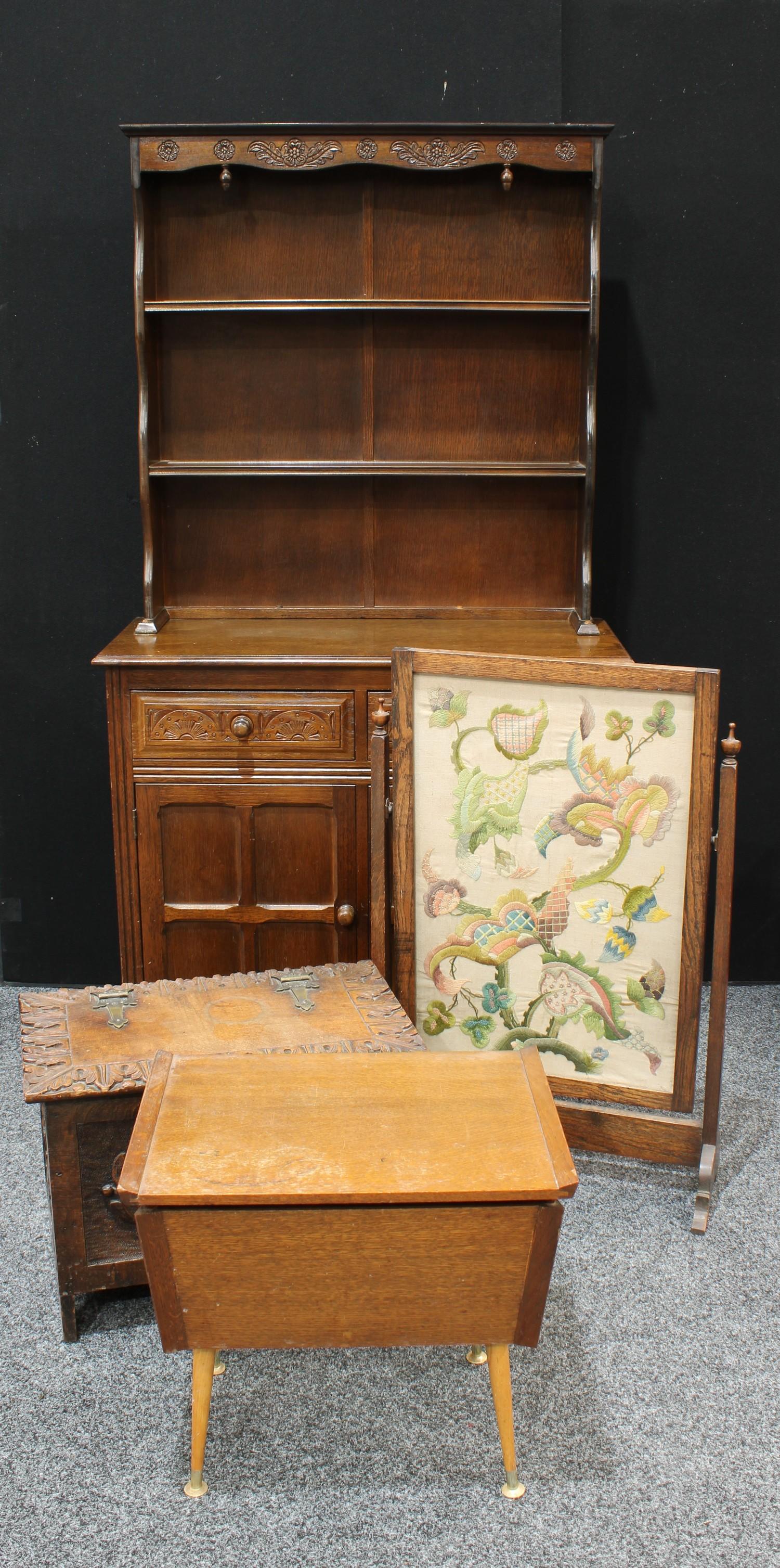 An oak dresser, two drawers over two panelled cupboard doors to base, 178cm high, 94cm wide; a