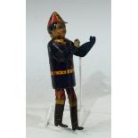 An early 20th century tinplate clockwork climbing fireman