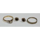 An 18ct gold solitaire ring; a half eternity ring; a pair of saphire earrings