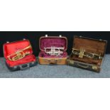 Musical Instruments - a King Cleveland 602 cornet, cased; a Corton trumpet, 031461, cased and a