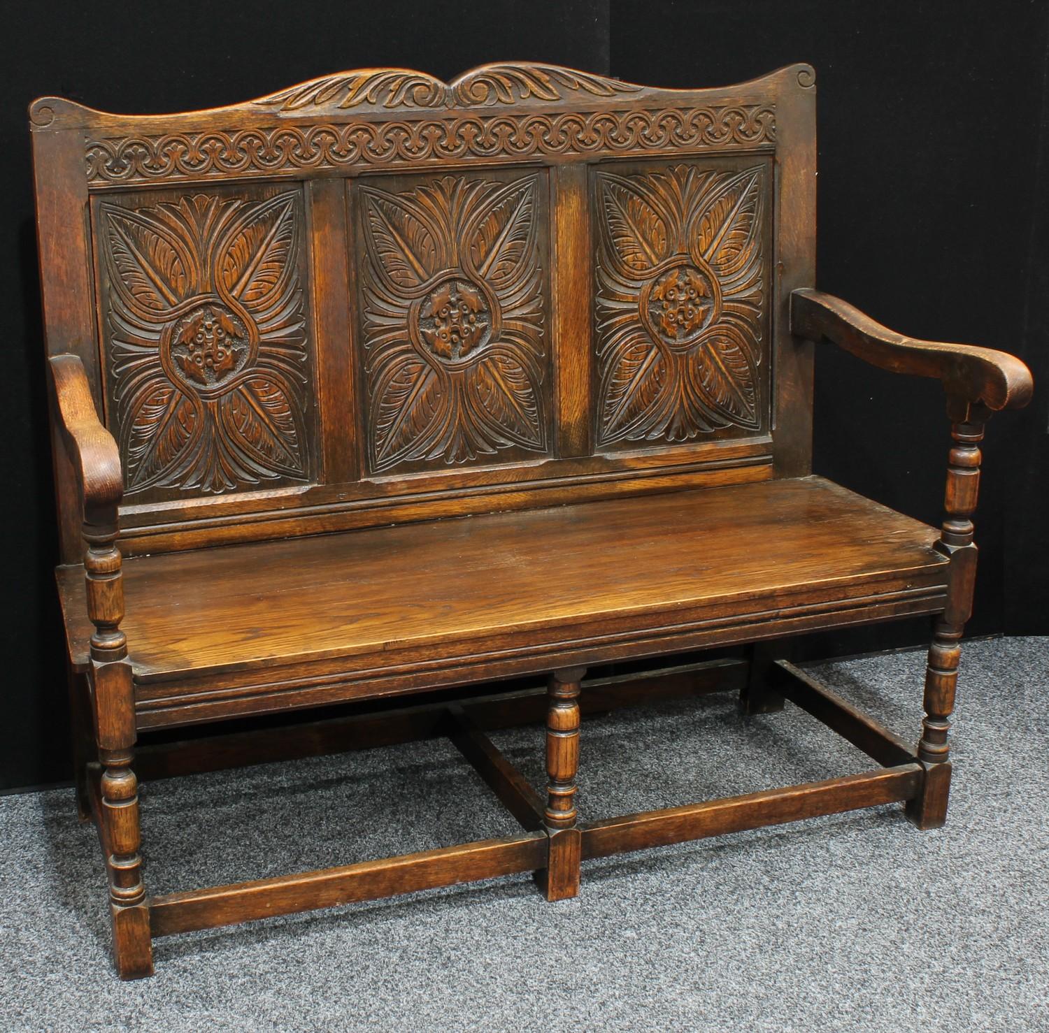 A 17th century style oak bench/settle, shaped cresting rail carved with acanthus, above a three - Image 2 of 2