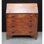 A George III oak bureau, fall front enclosing interior, one short above three graduated drawers,