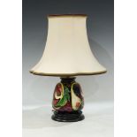 A contemporary Moorcroft table lamp, applied with figs and pomegranates, 17cm ( 42cm overall)