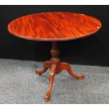 A George III style tripod supper table, cabriole legs, 91cm wide.