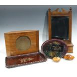 An Edwardian hall mirror with hinged glove box, 54cm; a speaker; a carved Japanese tray; another;