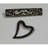 A Hamish Dawson Bowman Scottish Celtic silver bar brooch. cast with intertwined dragons, impressed