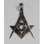 A silver masonic pendant