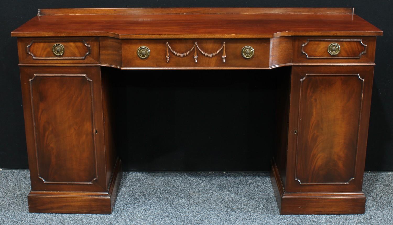 A George III style mahogany pedestal sideboard, in the Adam Revival taste,168cm wide, 93cm high.