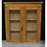 A two door pine wall hanging display cabinet/book case, twin fixed shelf interior, 123cm high, 110cm