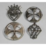 A matched pair of Ola M Gorie silver St Boniface cross brooches, Edinburgh 1967 and 1972; a John