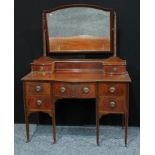 An Edwardian mahogany bow fronted dressing table, tapered square legs, 122cm wide