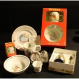 Nursery Ware - a Wedgwood Peter Rabbit baby's breakfast set; a Wedgwood Rupert Bear breakfast set,