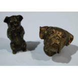 A Victorian novelty brass vesta, as a pug's head, 4.5cm long, c.1890; another, of a dog, begging,