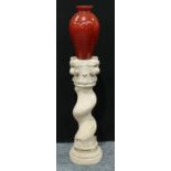 A faux garden pedestal, 93cm; Spanish red glass vase, 45cm (2)