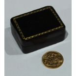 An Elizabeth II full gold sovereign, 1958, in a small Italian tooled leather box
