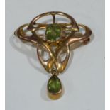 A 9ct gold Art Nouveau peridot brooch, marked 9ct