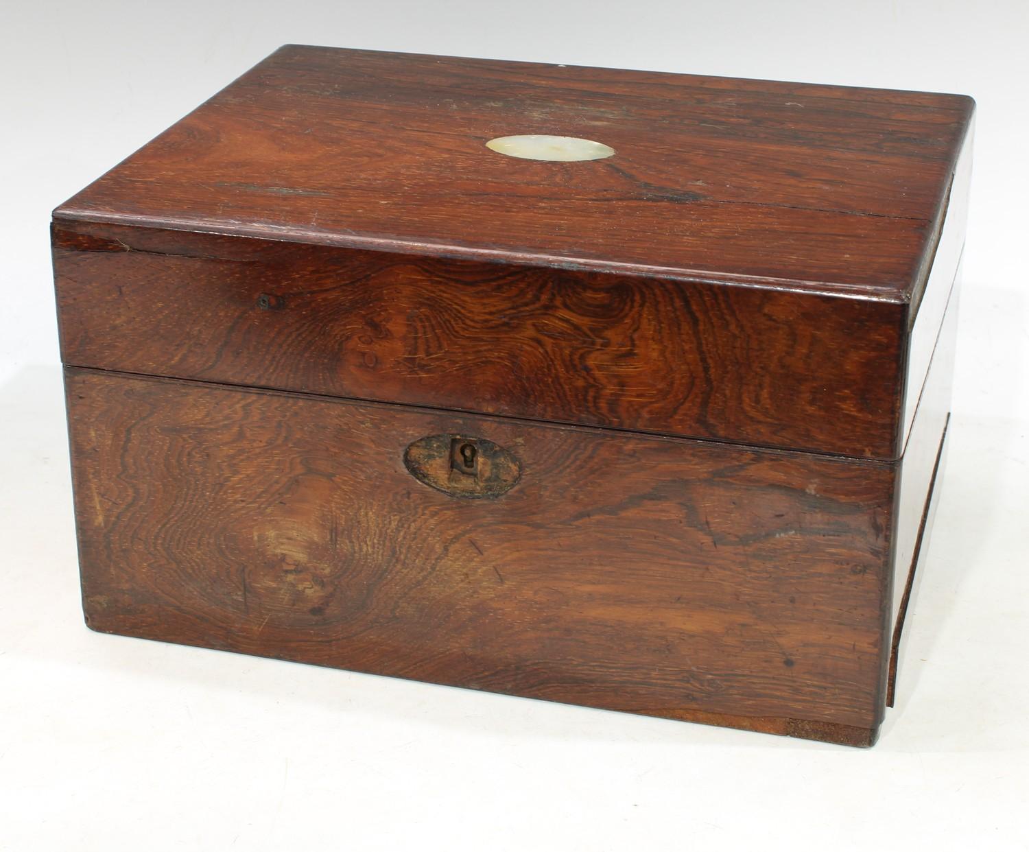 A Victorian mahogany work box, fitted with unmarked white metal topped dressing table jars, red