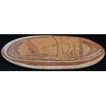 Tribal Art - an Australian Aboriginal shield, carved with a figure hunting a kangaroo, outlined with
