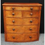 A Victorian mahogany bow fronted chest, two short and four long graduaterd cockbeaded drawers,