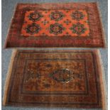 A middle eastern wool carpet with red tones, another similar. 195cm long, 135cm wide.(2)