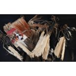 Tribal Art - a feather headdress, probably Indonesian; etc, Bonhams part-lot labels