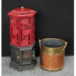 A Victorian style cast iron electric heater, hexagonal top, pierced body. 76cm high; a copper