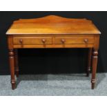 A Victorian mahogany writing table, shaped half gallery, rounded rectangular top above a pair of