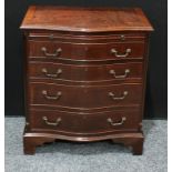 A George III style mahogany serpentine bachelor?s chest, the slide above four long drawers,