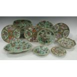 A Cantonese oval serving plate, decorated with alternating panels of figures and flowers and