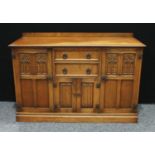 A 20th century oak sideboard, shallow half gallery, moulded rectangular top above two short