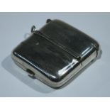 An Edwardian rounded rectangular novelty combination vesta and sovereign case, hinged covers with
