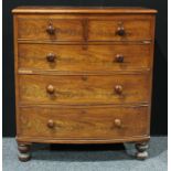 A Victorian mahogany bow front chest of drawers, moulded top above two short and three long