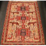 A Middle-Eastern rectangular woollen rug, the field with a dense arrangement of stylised animals and
