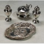A silver cruet set, Birmingham; a silver pin tray, Birmingham, 1904 (4)