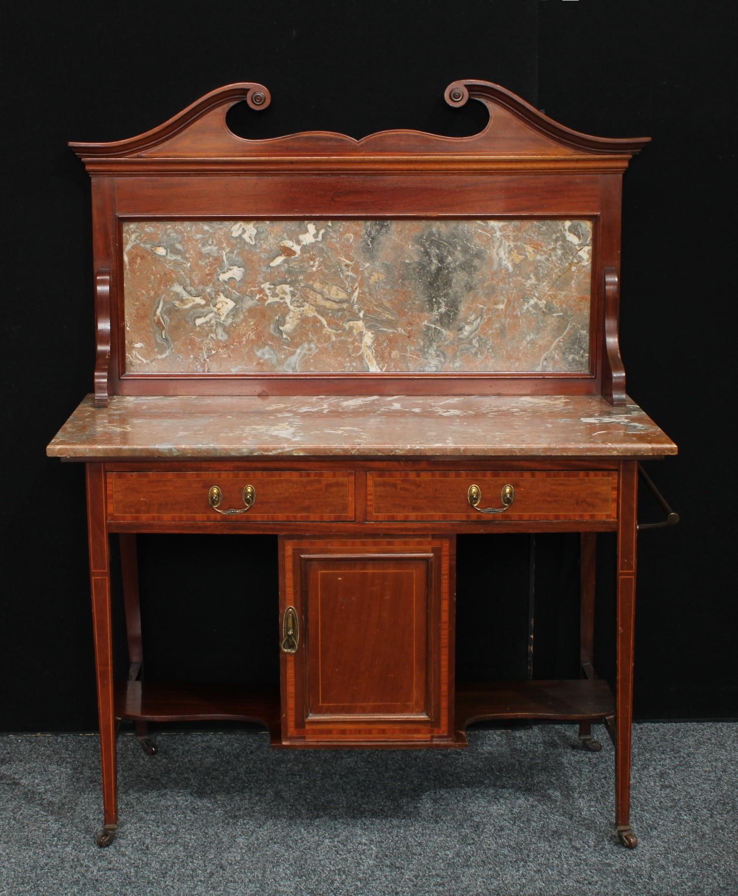 A Edwardian mahogany washstand, swan neck pediment above a rectangular marble top, two short drawers