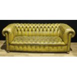 A Chesterfield type sofa, button back, scroll arms, 204cm wide