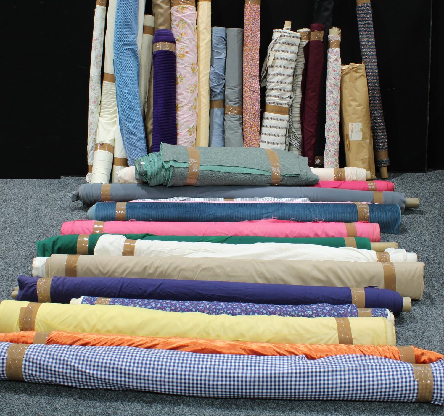 Textiles - fabric rolls, assorted patterned and plain, floral, striped, textured examples, mixed