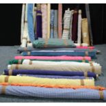 Textiles - fabric rolls, assorted patterned and plain, floral, striped, textured examples, mixed