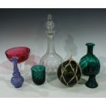 Glassware - an emerald glass decanter; a similar wrythen beaker; a witches ball; a clear glass