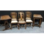 An oak oval gateleg dining table and four oak ladder back dining chairs; an oak oval drop leaf
