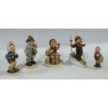 M J Hummel figure of a skier holding a pair of wooden poles; M J Hummel figure 'village boy',