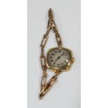 A lady's 9ct gold watch, the square case with circular dial, Arabic numerals, 9ct gold expanding